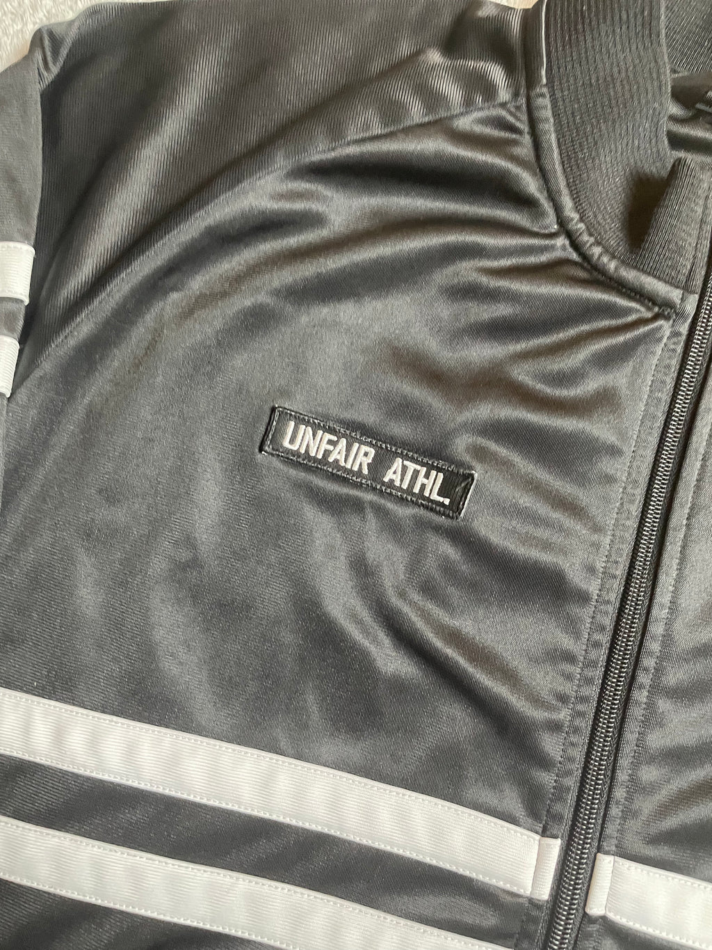 Unfair Athletics Trainingsjacke in schwarz, weiß - Gr. M