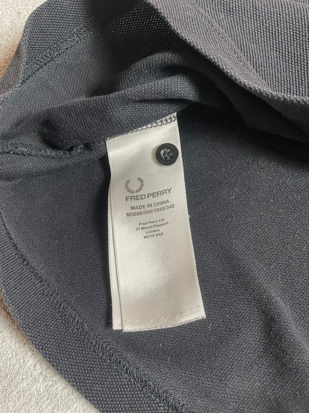 Fred Perry Poloshirt in schwarz, gelb - Gr. L